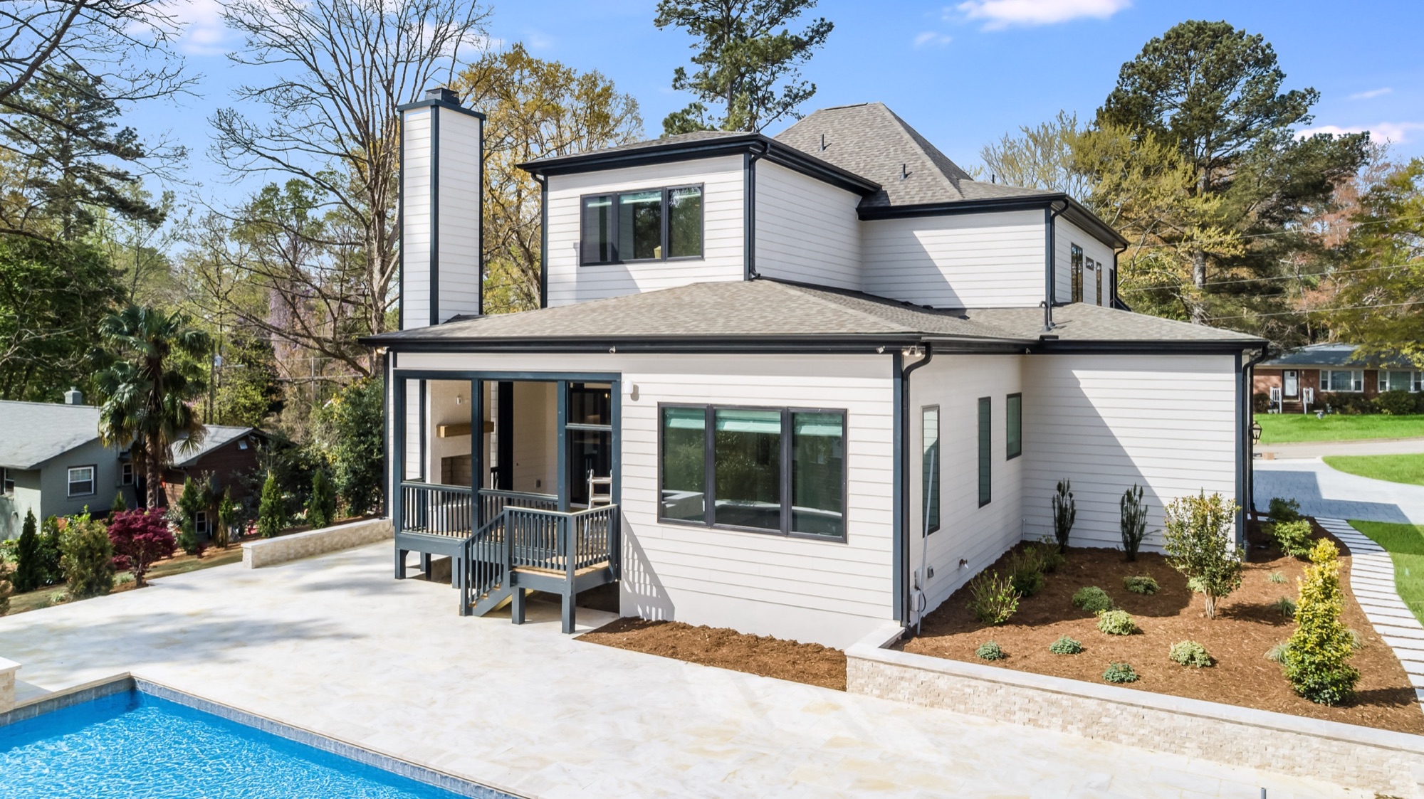 Custom home with a screened porch and pool by Gemstone Homes