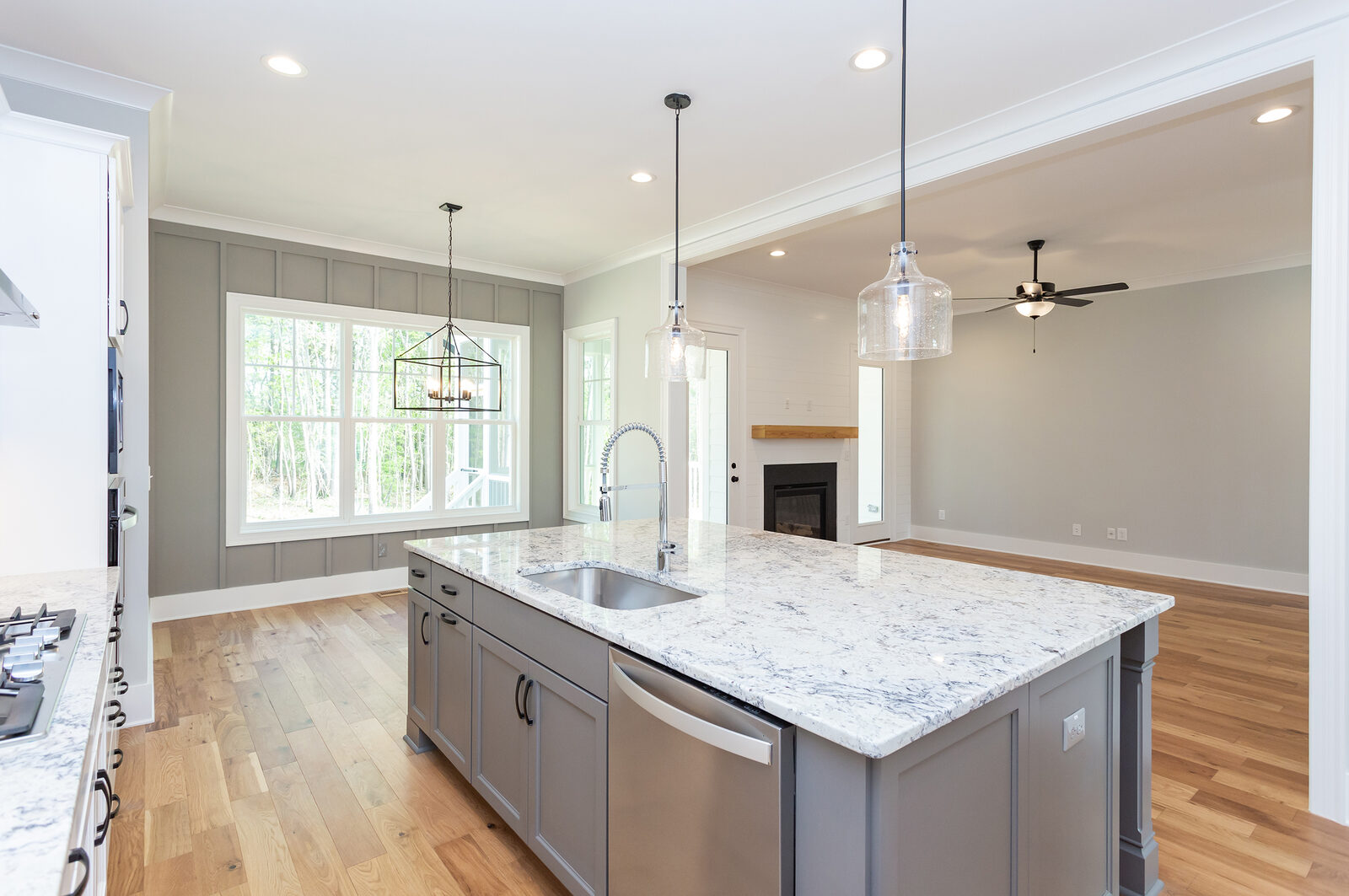 Open kitchen and great room in a Gemstone custom home