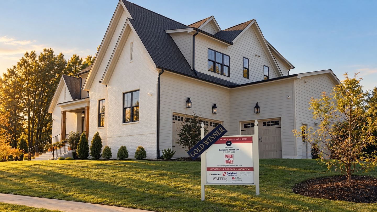 The Onyx with a Triangle Parade of Homes sign and a Gold Winner rider in the front yard