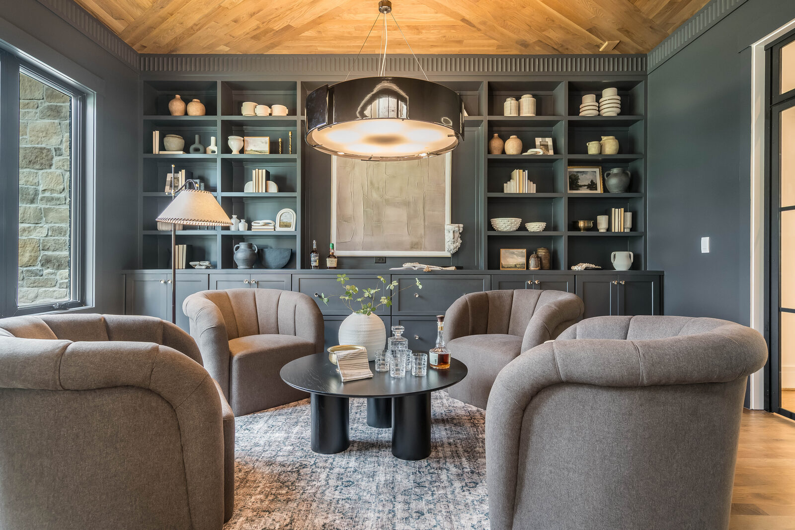 A styled sitting room arranged for conversation in a Gemstone custom home