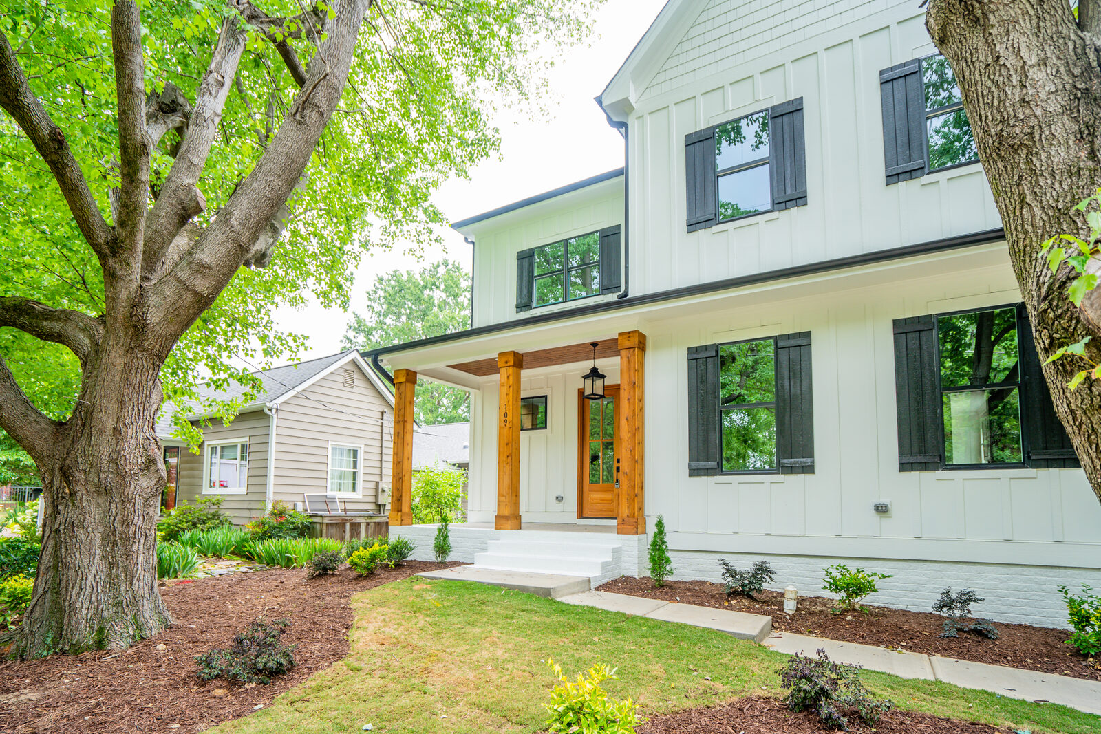 A finished Gemstone custom home at golden hour with an established, settled landscape