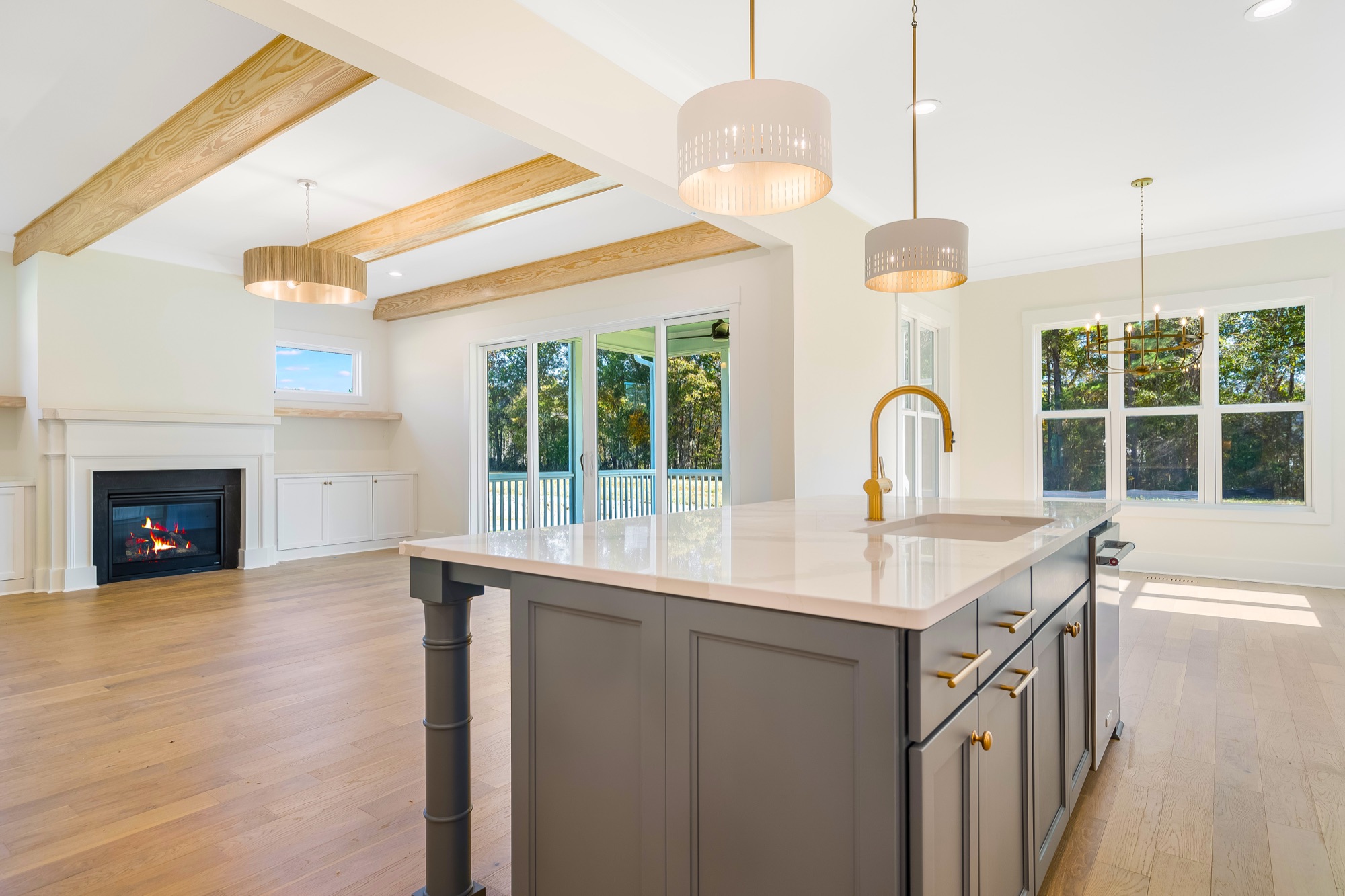 Open-plan family room and kitchen in a Gemstone custom home
