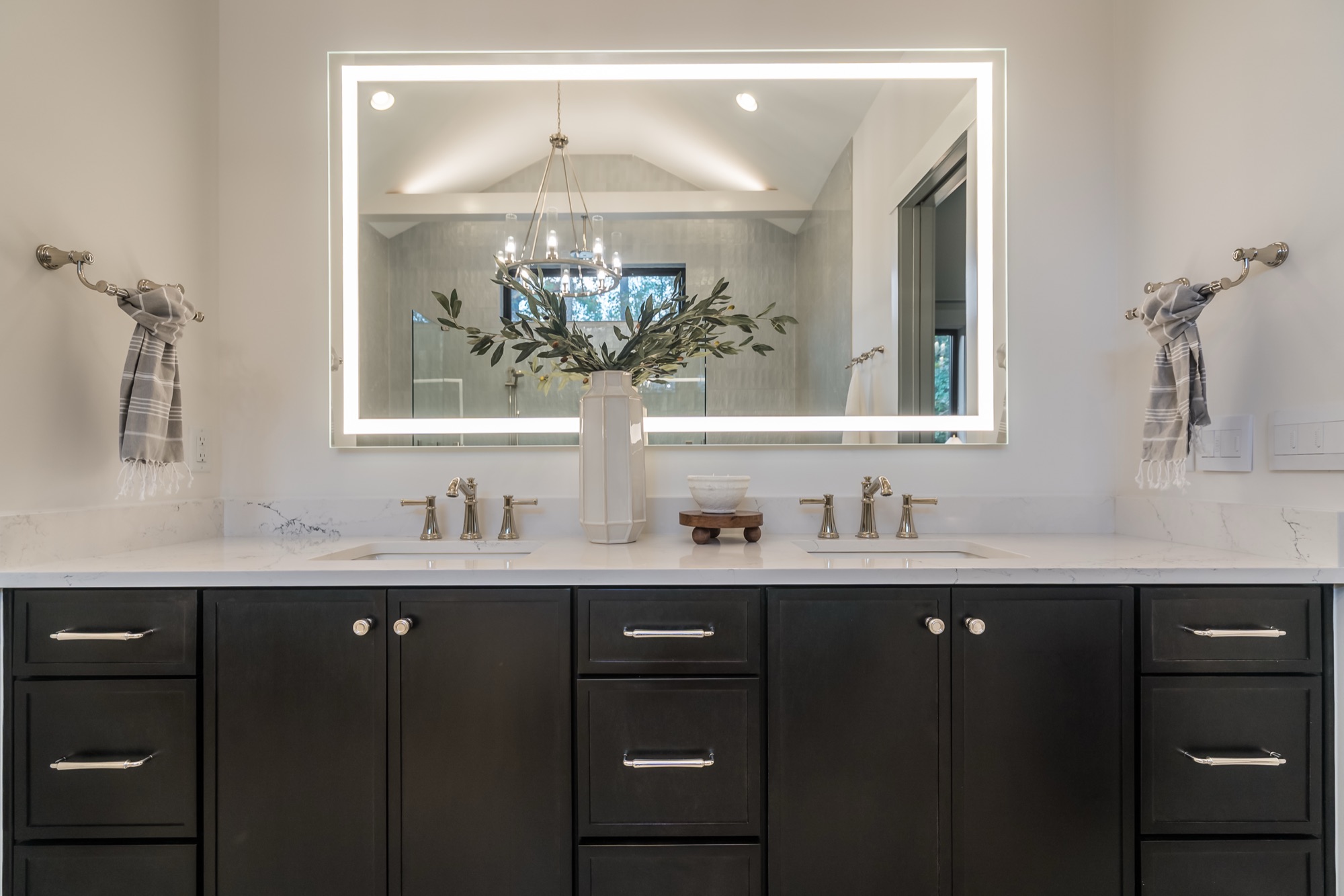 Double vanity with a lighted mirror in a Gemstone home