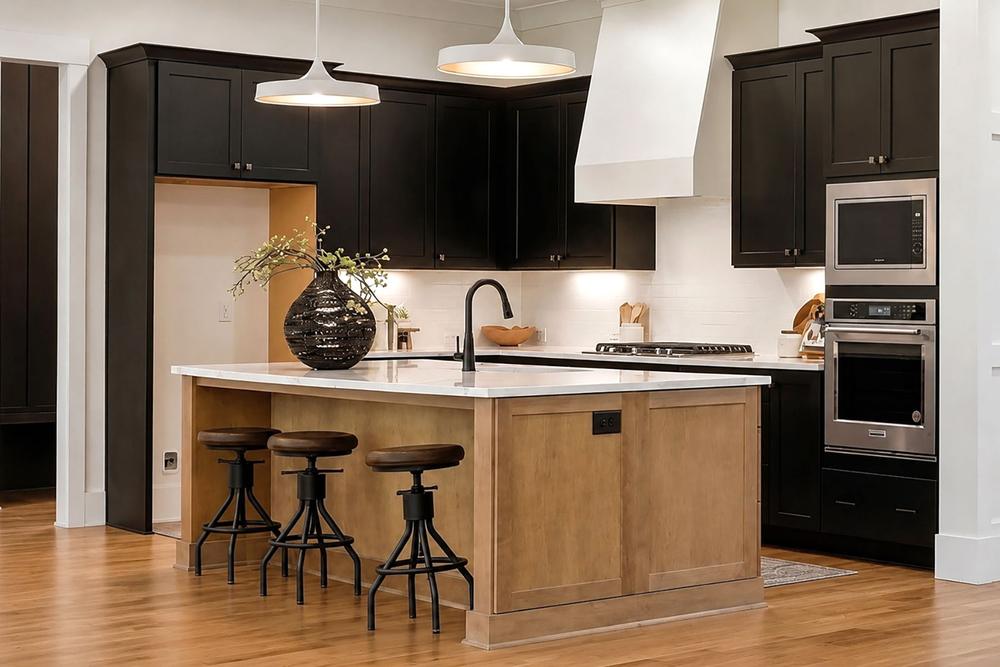 The Durant Road kitchen with black cabinets and a wood island