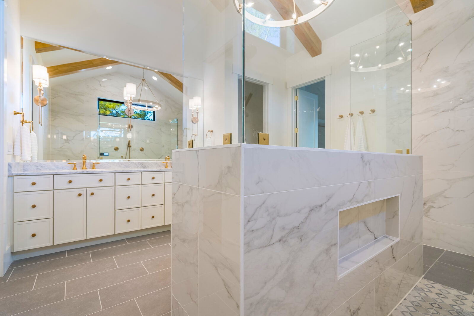 Marble primary bath in a Gemstone custom home at McLaurin Farms
