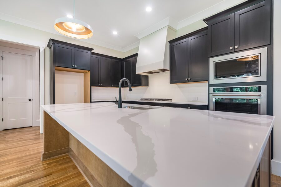 Kitchen Black Cabinets in The Emerald, a Gemstone Homes custom home
