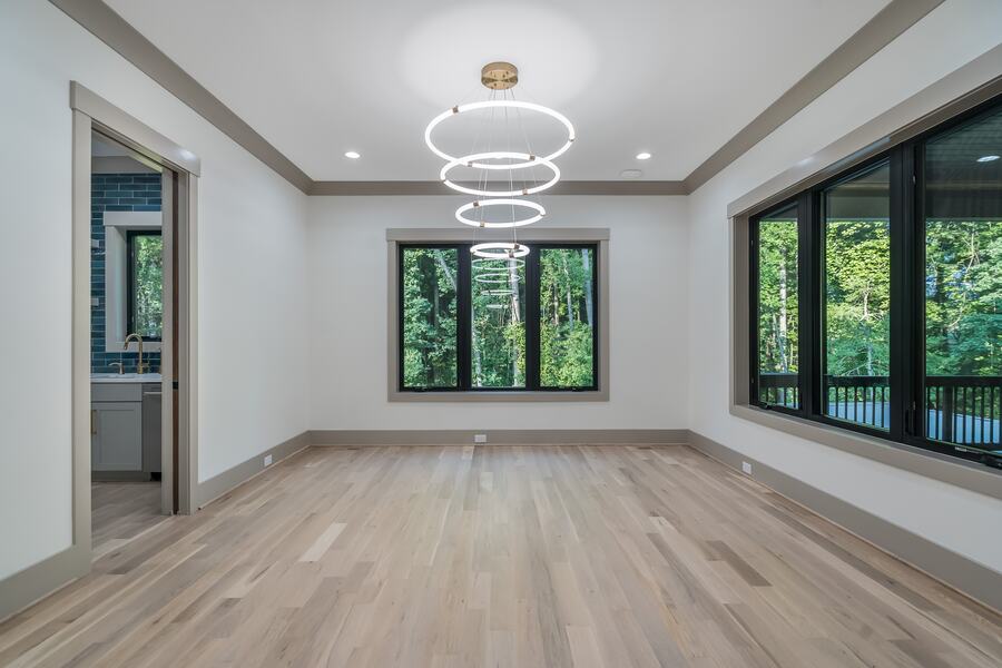 Four-ring chandelier over the dining room of a Gemstone custom home