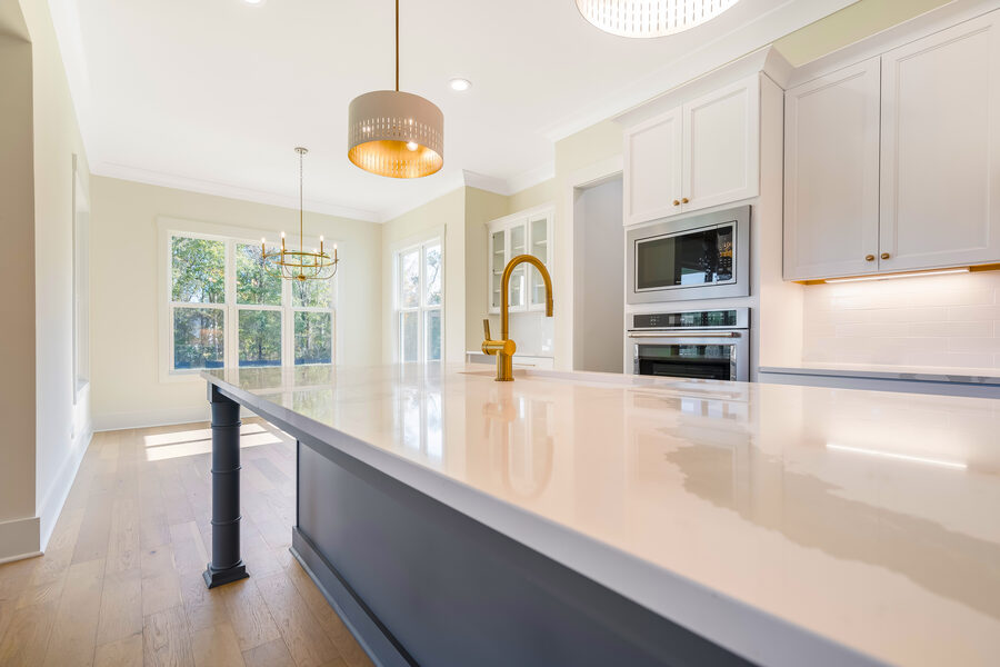 Brass Kitchen Island in The Morefield, a Gemstone Homes custom home