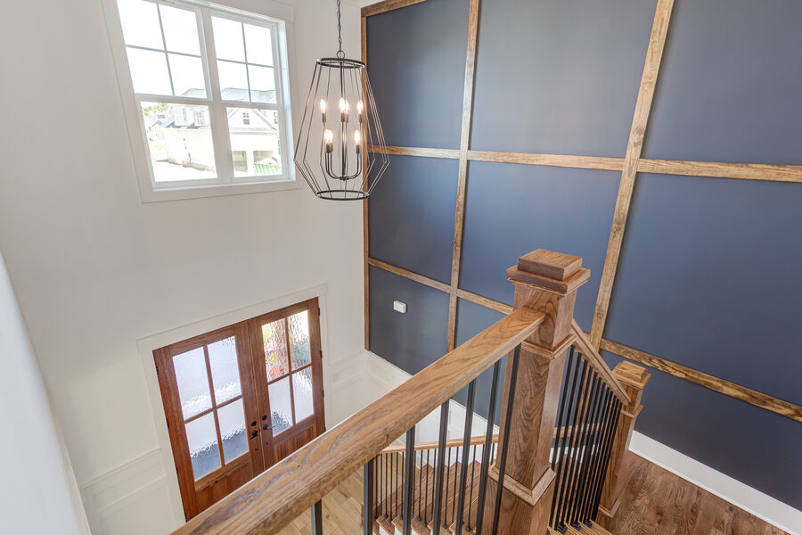 Foyer Navy Grid Stair in Parade Home 2022, a Gemstone Homes custom home
