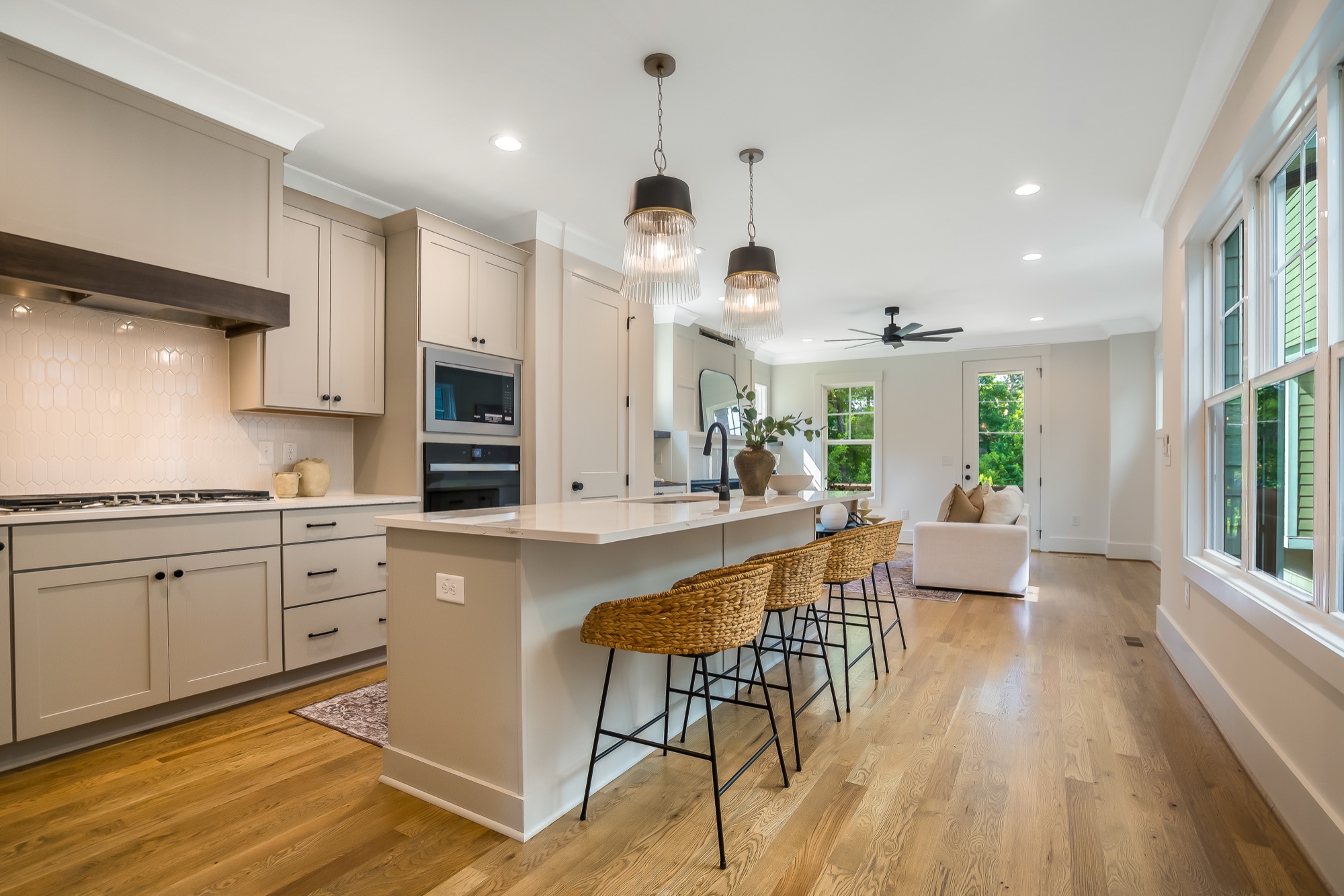 Kitchen with a waterfall island in a Gemstone cottage in Apex, NC